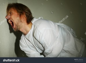 stock-photo-mentally-ill-man-in-strait-jacket-in-room-corner-168900344.jpg